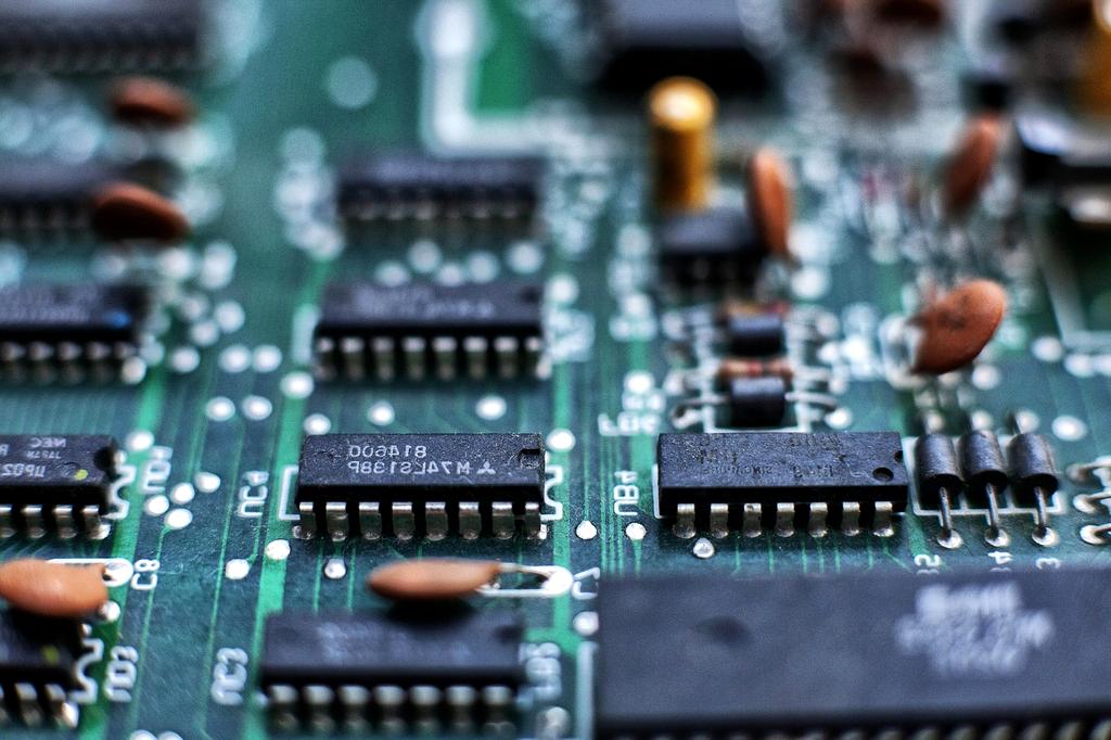 Close-up of a solid state drive chip with performance graphs